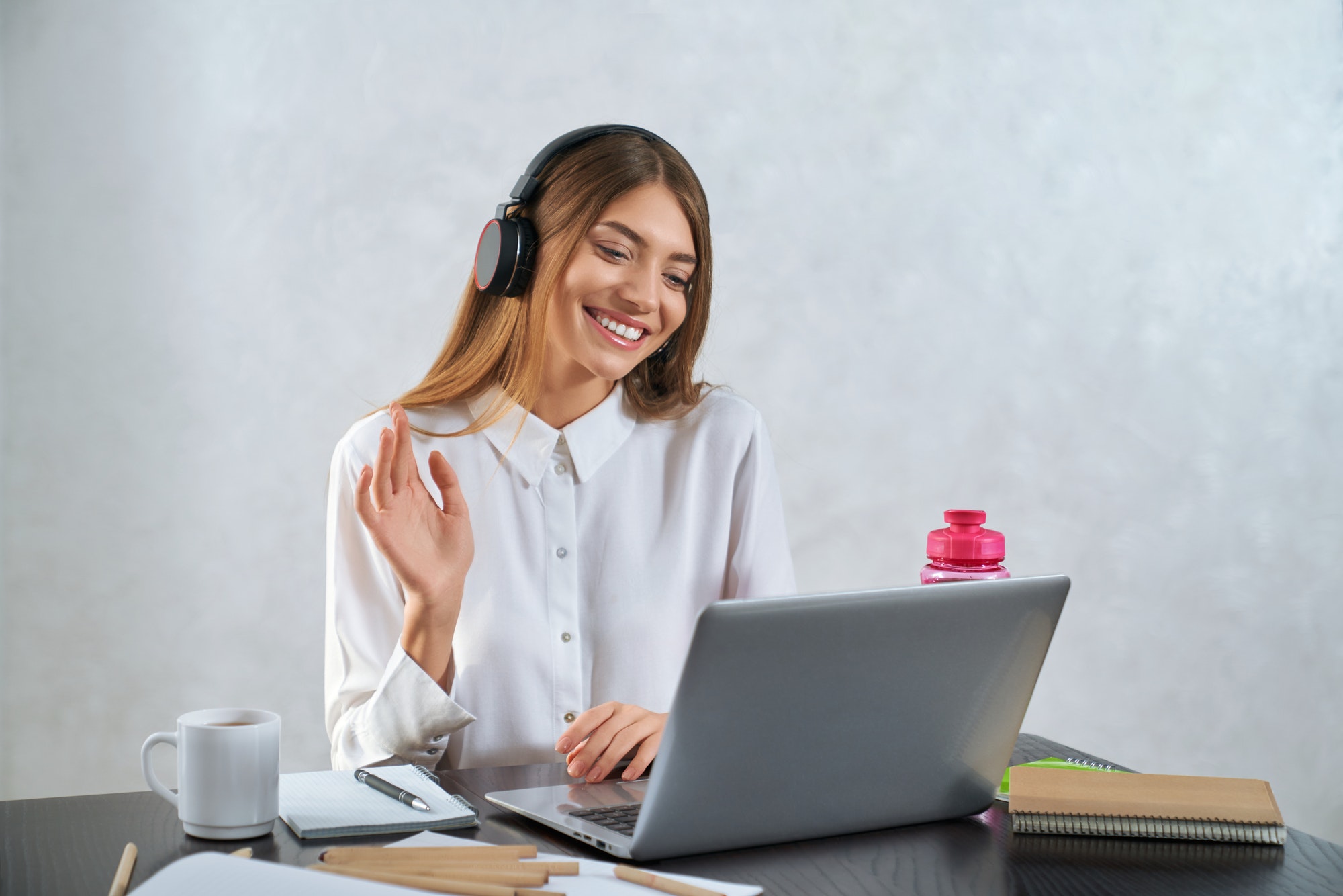 woman-waving-and-talking-during-online-education-on-laptop.jpg woman-waving-and-talking-during-online-education-on-laptop.jpg